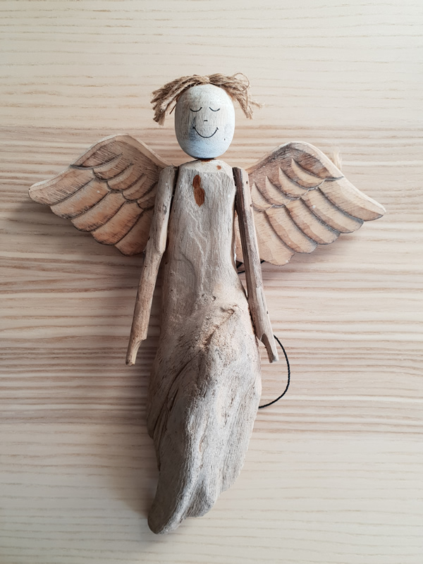 Wooden bali angels craftsmen handmade organic christmas sally bourne interiors london